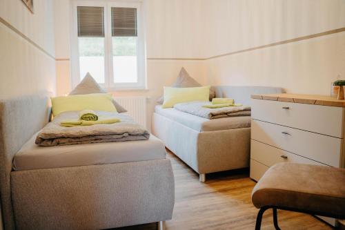 Ένα ή περισσότερα κρεβάτια σε δωμάτιο στο Auszeit Domizile