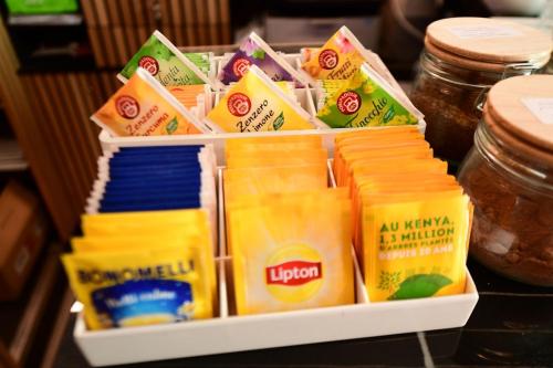 a container filled with cheese and other food items at Suites Ansidei - Acquedotto in Perugia