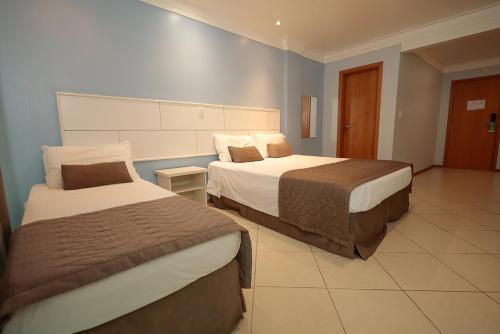 Ένα ή περισσότερα κρεβάτια σε δωμάτιο στο Ita Park Hotel