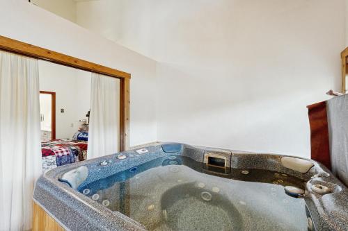 a bath tub in a room with at Mountainside 049 in Granby