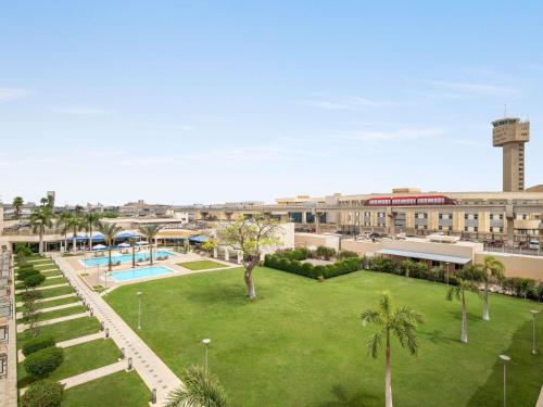 an image of a park in the middle of a city at Novotel Cairo Airport in Cairo