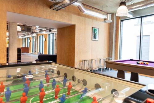 a room with a table and ping pong balls at City View Ensuites and Studios Martha Street Glasgow in Glasgow