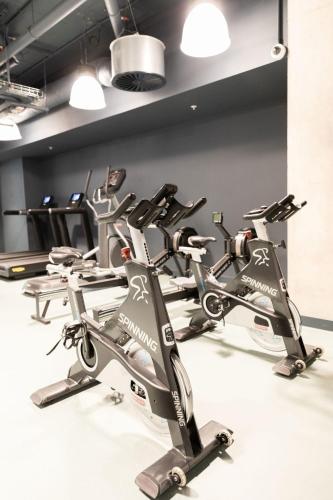 a row of exercise bikes in a gym at City View Ensuites and Studios Martha Street Glasgow in Glasgow