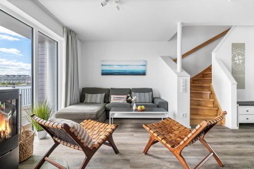 a living room with a couch and a table at Ferienhaus Seestern Olpenitz in Olpenitzdorf