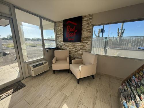 a waiting room with two chairs and a window at Red Roof Inn Tucson - Vail in Tucson
