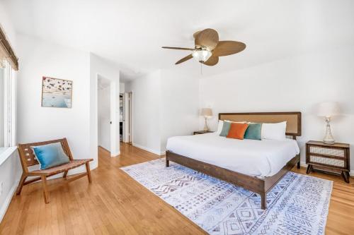 a bedroom with a bed and a ceiling fan at 2BR-2 mins to Ocean-Sleeps 8-Pets in San Diego
