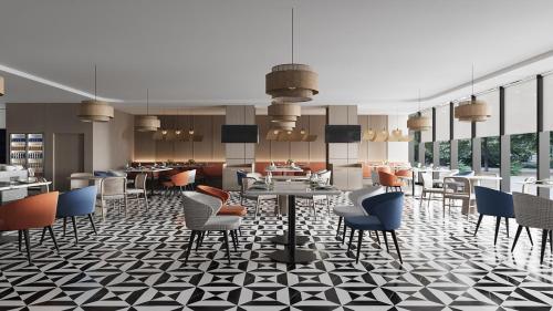 a rendering of a restaurant with chairs and tables at Holiday Inn Express Kunming Yiliang Center by IHG in Kunming