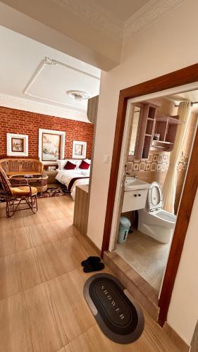 a view of a room with a mirror and a bedroom at Raniban Suites - Apartment Home in Kathmandu