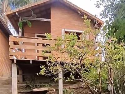 a house with a balcony on the side of it at O Chalé de Rita in Lima Duarte