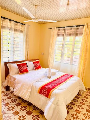 Ένα ή περισσότερα κρεβάτια σε δωμάτιο στο Mauville Diani