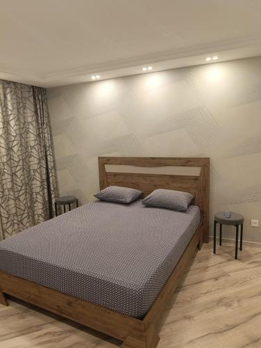 En eller flere senge i et værelse på Уютная квартира в центре!