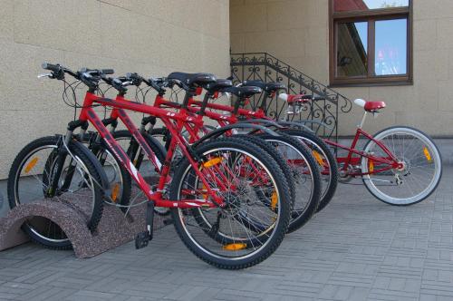 a row of red bikes parked next to a building at Veski Guesthouse in Antsla