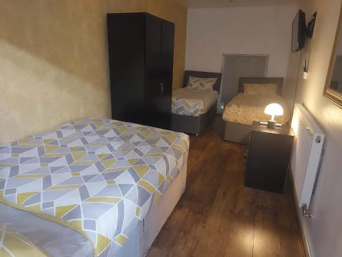 Postel nebo postele na pokoji v ubytování Rusholme Rooms