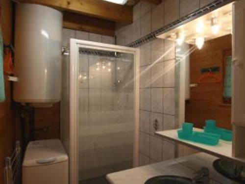 a bathroom with a shower and a toilet and a sink at Charmant Chalet Vosgien – Idéal Couple/Curistes – Calme et Nature – Proche Plombières-les-Bains - FR-1-589-230 in Le Val-dʼAjol