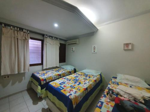 Postel nebo postele na pokoji v ubytování Casa agradável no Pontal de Maria Farinha