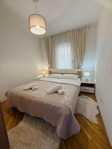 Ένα ή περισσότερα κρεβάτια σε δωμάτιο στο Comfort corner Podgorica