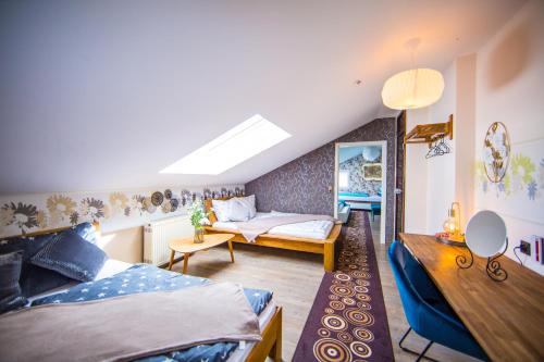 a living room with two beds and a couch at Premium Stay Academy - Luxus-Ferienwohnungen mit Erlebnis in Bad Ems