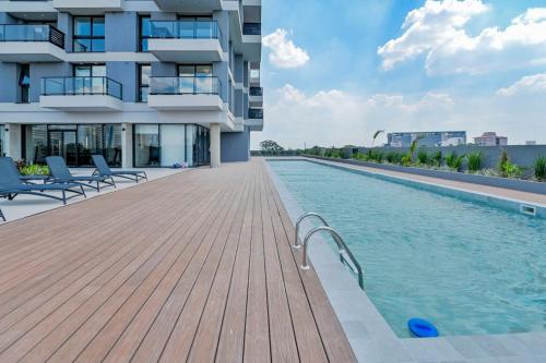 a swimming pool on the side of a building at Stylish Retreat Steps from Shopping del Sol in Asuncion