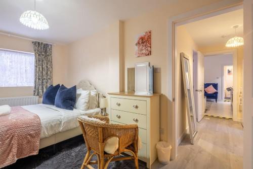 a bedroom with a bed and a tv on a dresser at Newly refurbed 3Bed Annexe - With Parking! in Albury