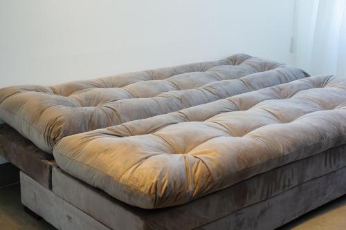 En eller flere senge i et værelse på Residencial Jardins do Atlântico