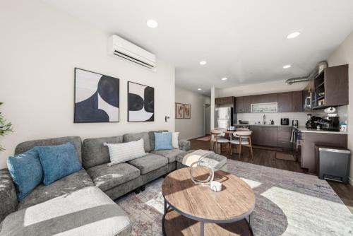a living room with a couch and a table at 2BR Cozy Apartment in DT in Spokane