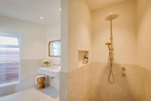 a bathroom with a shower and a sink at Ideally Located Modern Studio Apartment in Dunsborough