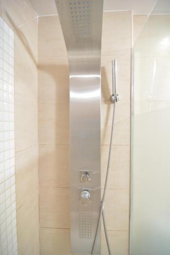 a shower with a glass door in a bathroom at Apartamento Tenerife Sur in Playa de las Americas