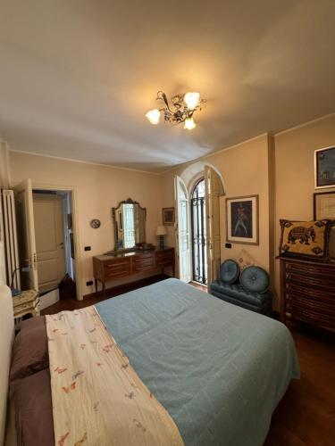 a bedroom with a large bed and a mirror at La Terrazza in Viareggio
