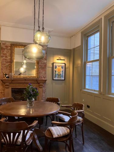 a dining room with a table and chairs at The Saltburn Townhouse in Saltburn-by-the-Sea