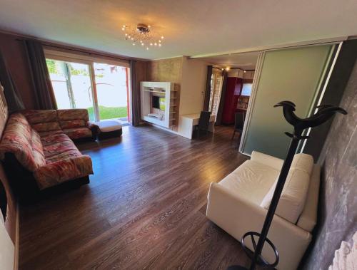 a living room with a couch and a chair at B2In Suite & Office in Capriate San Gervasio