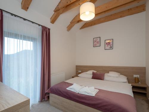 Postel nebo postele na pokoji v ubytování Apartments Severka - Jasná