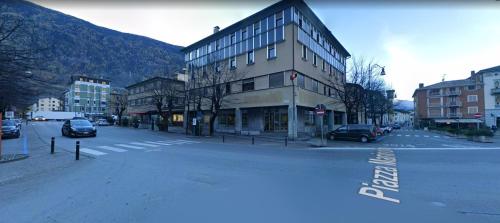 an empty street in a city with a building at Clessidra2 bilocale a 300m Bernina Express in Tirano