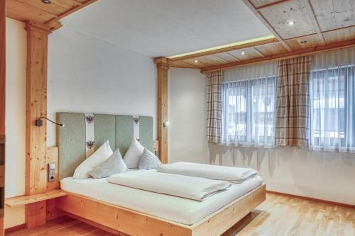 Ένα ή περισσότερα κρεβάτια σε δωμάτιο στο Apartment by Hotel Alpenstolz