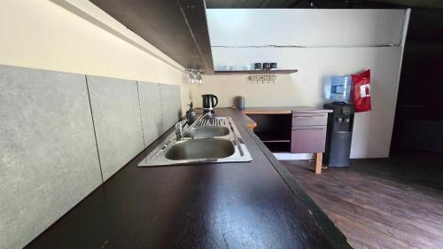 a kitchen with a sink and a counter top at Glamping tent in Nelspruit
