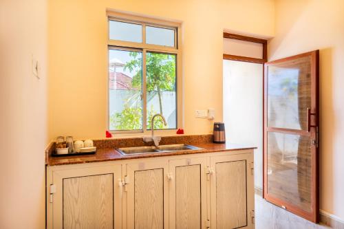 Nhà bếp/bếp nhỏ tại Coconut Breeze Apartments