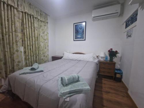 Ένα ή περισσότερα κρεβάτια σε δωμάτιο στο APARTAMENTO MADRID Norte