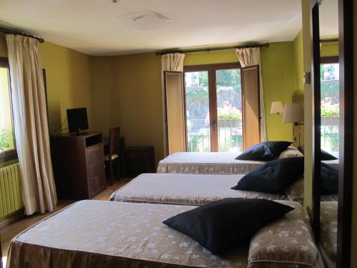 Postel nebo postele na pokoji v ubytování Hotel De Rei