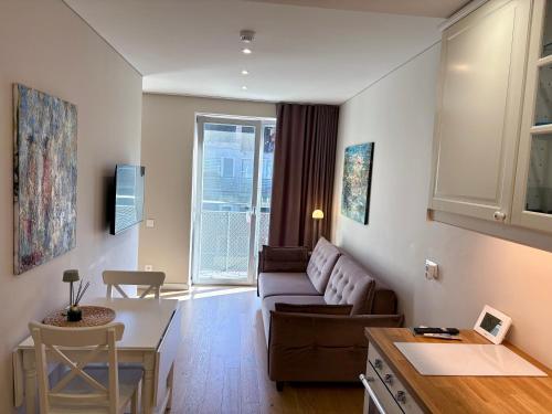 Posezení v ubytování Marios laiko apartamentai Juodkrantėje