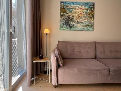 Posezení v ubytování Marios laiko apartamentai Juodkrantėje