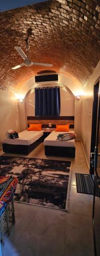 Postel nebo postele na pokoji v ubytování Masa Nubian House