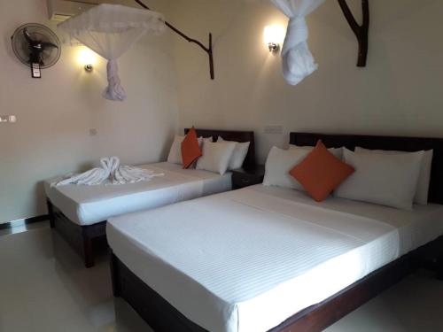 Postel nebo postele na pokoji v ubytování Ora Safari Resort