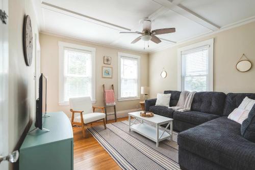 a living room with a couch and a table at Stay at East Gloucester in Gloucester