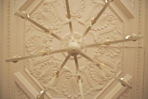 a large clock on the side of a wall at Grand Hotel Cesenatico in Cesenatico