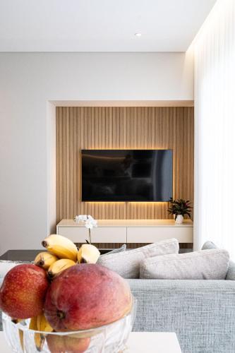 a bowl of fruit on a table in a living room at Casa Graminho in Ponta do Sol