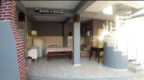 a model of a kitchen and a living room at Espaço Clarabella in Serra Negra