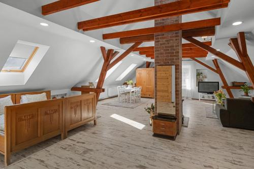 a living room with wooden furniture and a fireplace at Statek Luigi in Tuchlovice