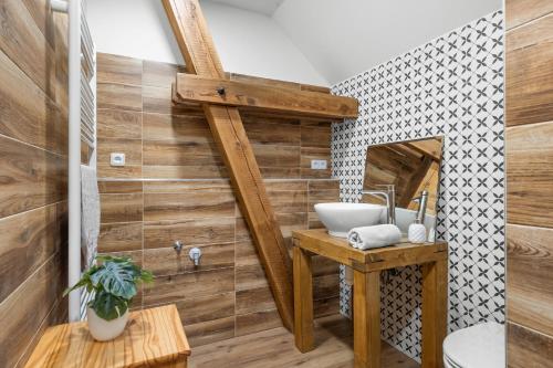 a bathroom with a sink and a mirror at Statek Luigi in Tuchlovice