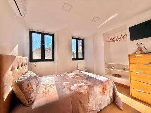 Ένα ή περισσότερα κρεβάτια σε δωμάτιο στο Casa Dos Passadiços Do Mondego