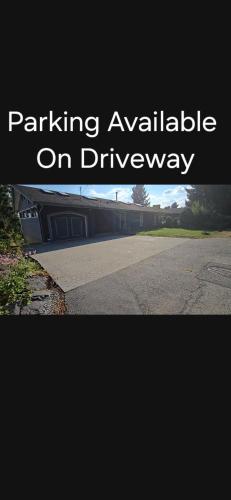 a picture of a street with the words parking available on driveway at Self Check-In Keyless Private Entry DBL Queen Suite in Mission City