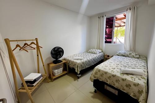 Una cama o camas en una habitación de Apê Com Estrutura de Resort